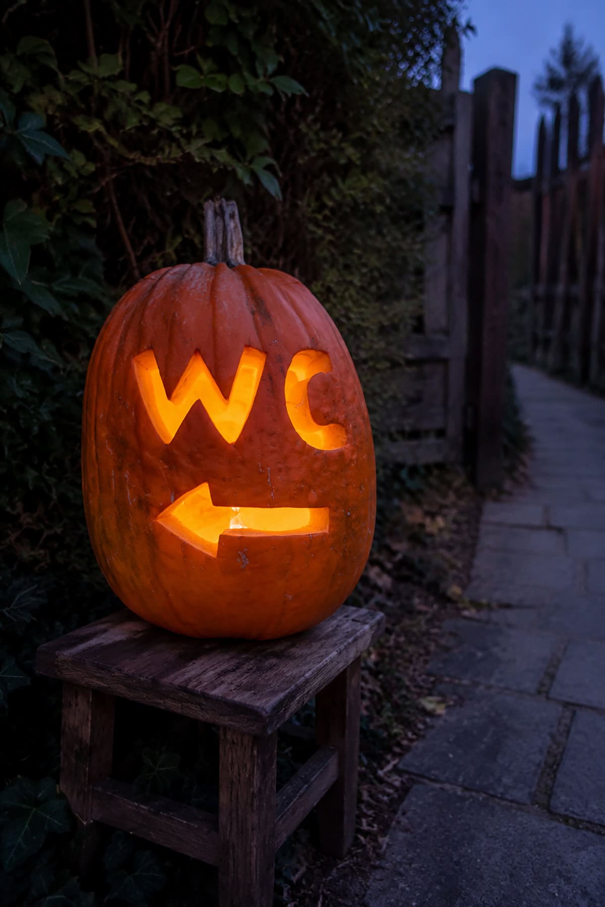 Carved Pumpkin Restroom Sign