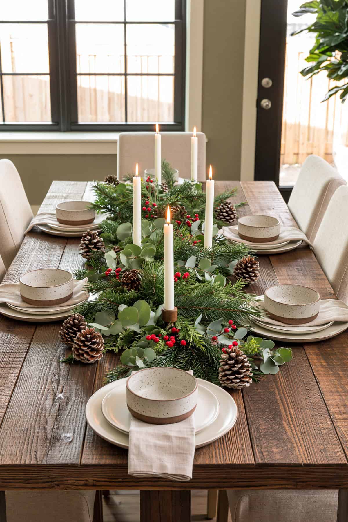 Eucalyptus And Pine Garland Across A Dining Table