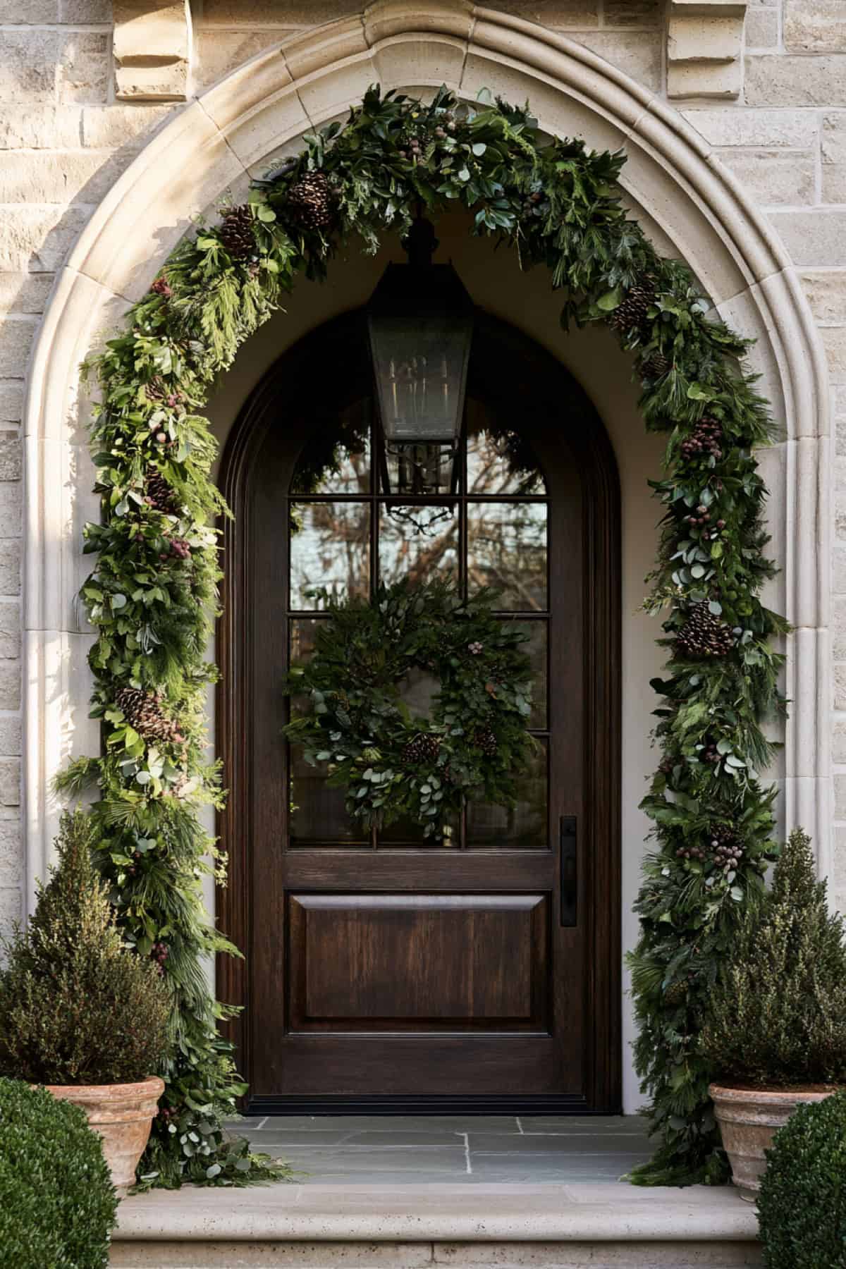 Evergreen Garland Around An Arched Front Door
