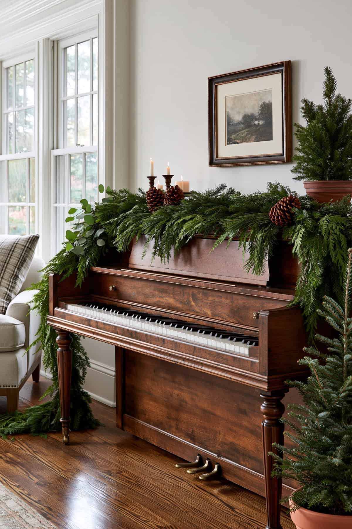 Evergreen Garland Draped Across A Piano