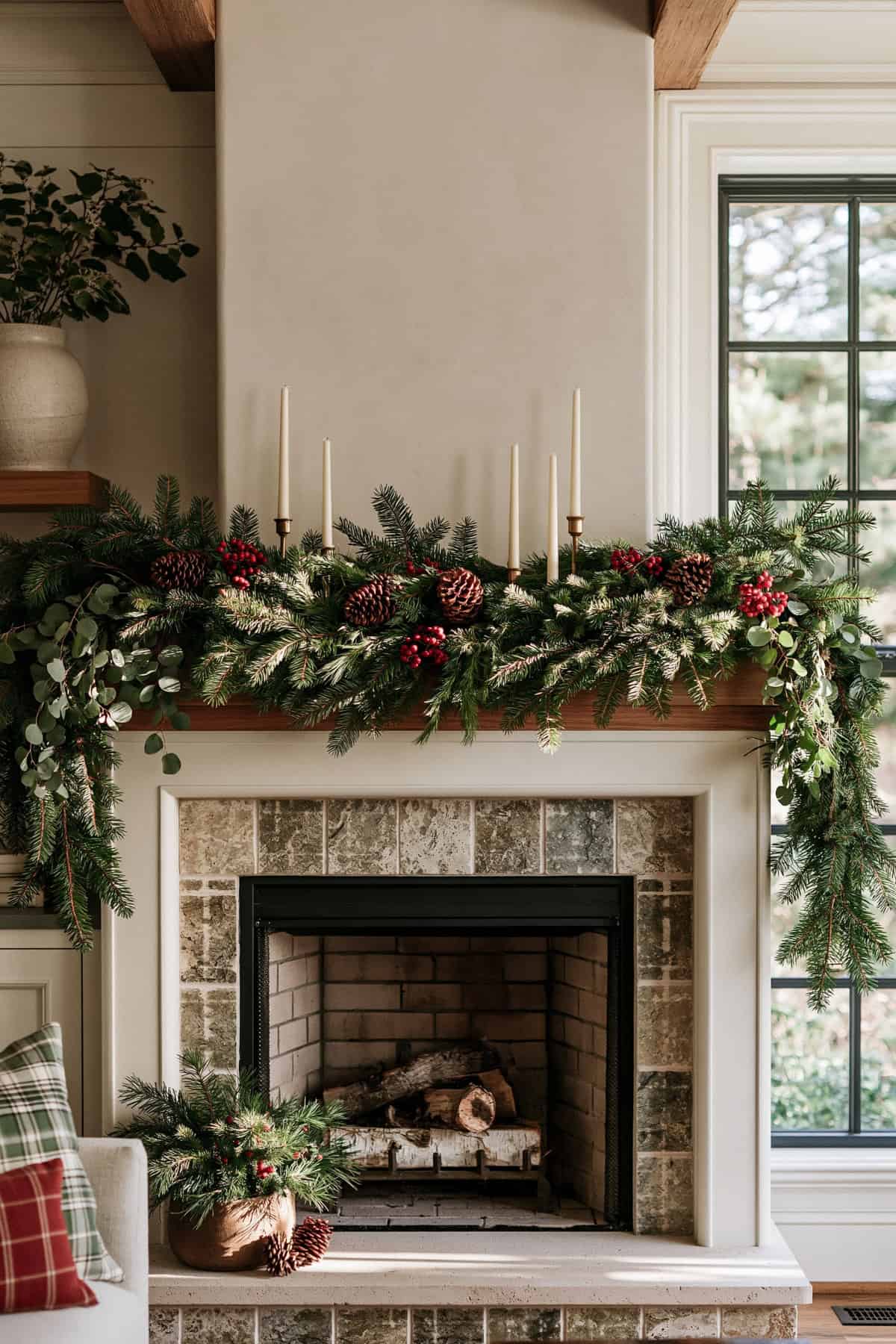 Layered Cedar Garland Over A Fireplace Mantel