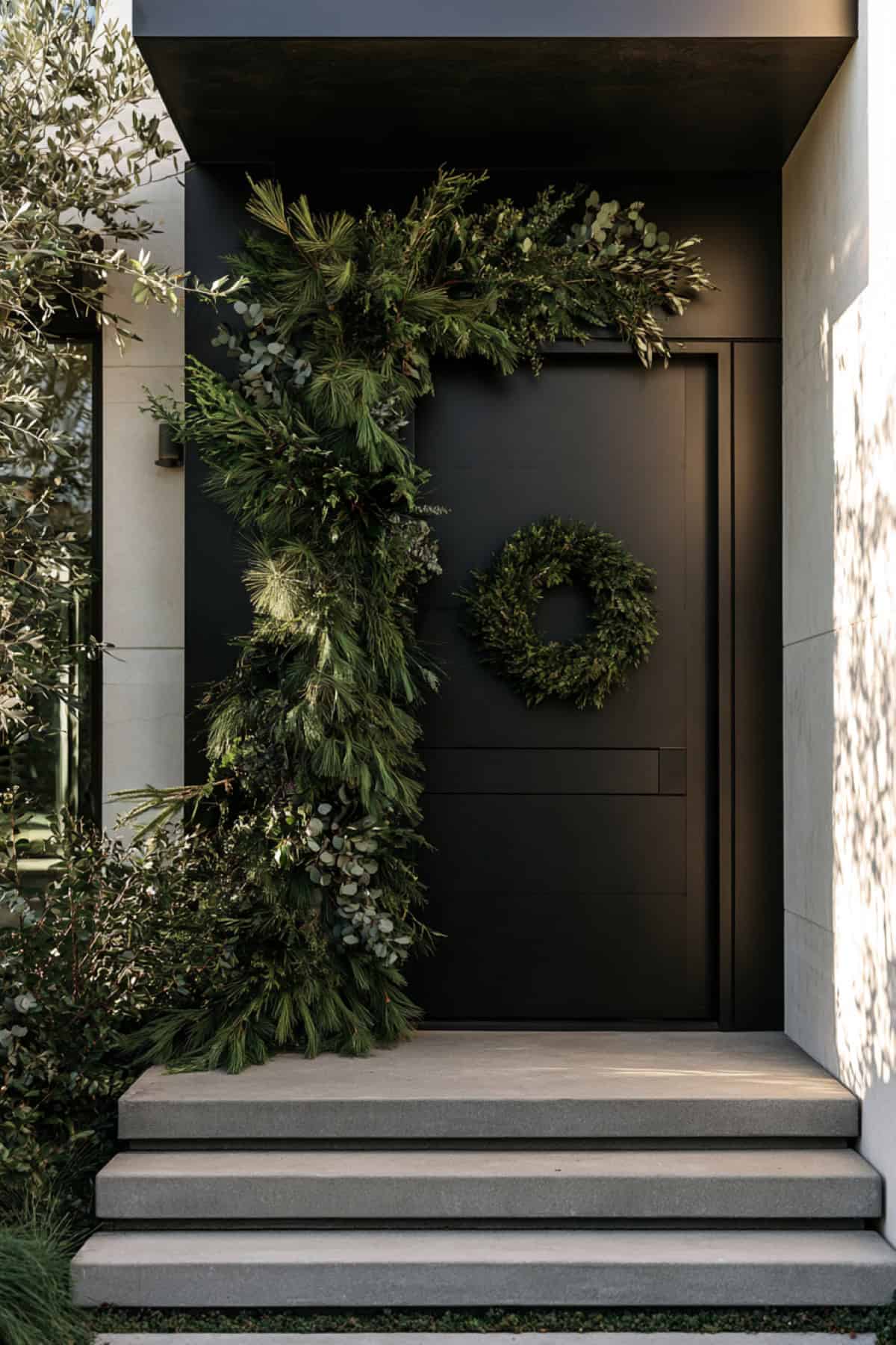 Modern Black Door With Sculptural Greenery