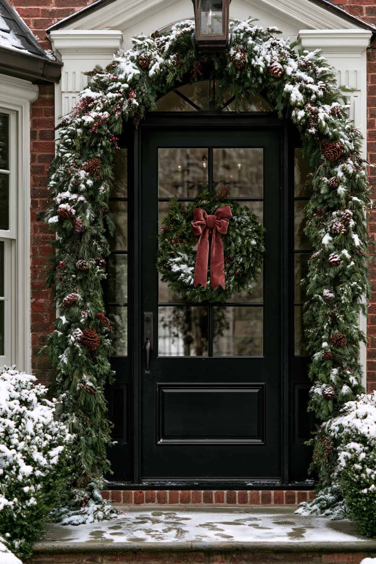 Snow-Dusted Evergreen Front Door Decor